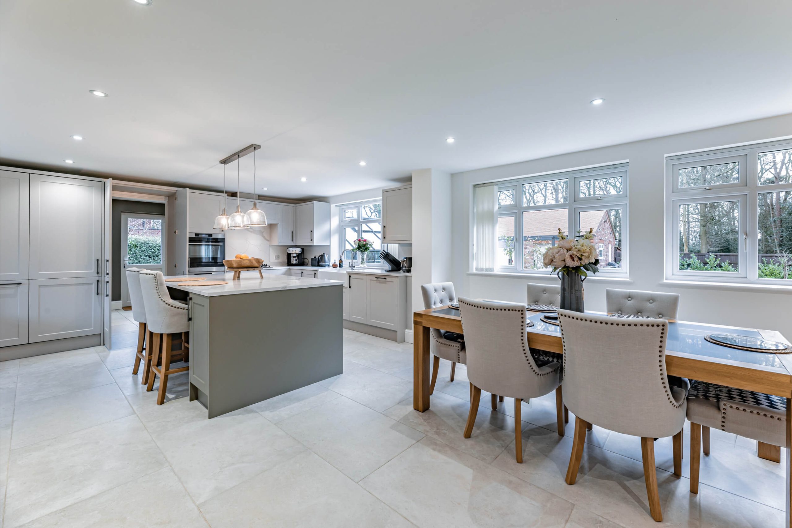 Contemporary kitchen and dining area in a Cheshire home with neutral décor