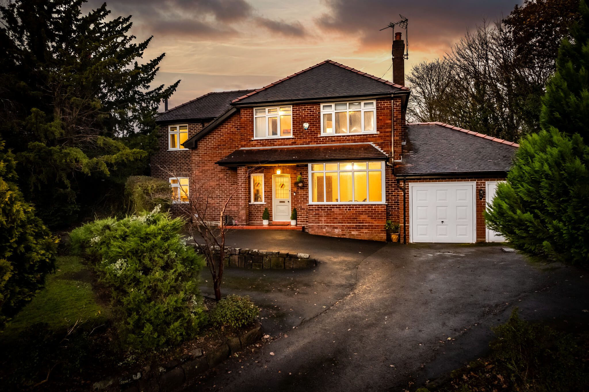 Front view of detached red-brick home at 645 London Road, Davenham in daylight