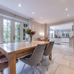Dining room with French doors leading to garden at open plan Davenham home.