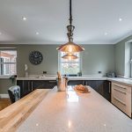 Bespoke modern home in Northwich showcasing quartz worktops, brushed metal fittings and dual-aspect natural light.