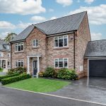 Detached Cheshire property at 4 Bell Crescent with private driveway, garage and manicured front garden.