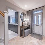 Inviting entrance hallway at 4 Bell Crescent, Davenham, Cheshire featuring herringbone flooring, console table and soft lighting creating a warm welcome.
