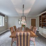 High-specification property in Northwich with elegant dining area, wooden furniture, and fitted cabinetry
