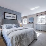 High-specification property in Northwich featuring the main bedroom suite with fitted wardrobes and dual windows.