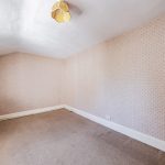 Third bedroom at Gladstone Cottage offering versatile space within this period property.