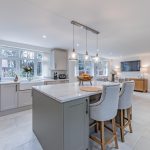 Kitchen island with pendant lighting and breakfast bar seating at Kennelwood Sandiway.