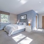Luxury Cheshire home with spacious principal bedroom, statement wallpaper and abundant natural light.