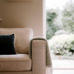 Living room detail showing sofa and garden outlook at Blossoms, Bostock — a luxury Cheshire home.