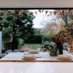 Dining area at a detached house on Church Street, Davenham with wide bi-fold doors framing views across the garden