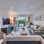 Contemporary family room at a Church Street, Davenham home opening onto a private patio through wide glazed doors