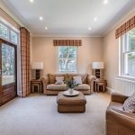Family sitting area with doors opening to garden at 3 The Woodlands, Hartford.