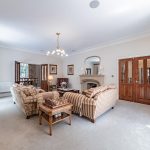 Formal dining room with garden views and patio access at 3 The Woodlands, Hartford, Cheshire.