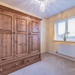 Bright third bedroom with wardrobe and outlook at 23 Pulford Close, Kingsmead.