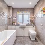 Modern family bathroom with bath and contemporary tiling at 24 Priory Avenue, Leftwich