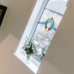 Landing arched feature window with stained glass detail at 24 Priory Avenue, Leftwich