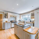 Traditional kitchen with range cooker and shaker cabinetry at Brock Lodge in Leftwich, Northwich