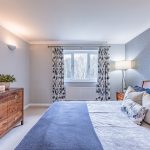 Principal bedroom with neutral decor and garden outlook at Brock Lodge, Northwich