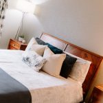 Stylish principal bedroom with feature headboard and soft furnishings at Brock Lodge, Northwich