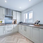 Kitchen worktop and sink area with window outlook and contemporary finishes
