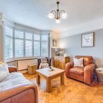 Bay fronted lounge with original parquet flooring and plantation shutters at 46 Hodge Lane Hartford