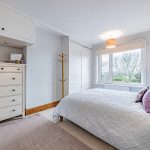 Second bedroom with built in storage and garden outlook at 46 Hodge Lane Hartford