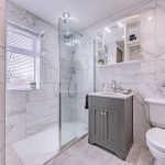 Contemporary family bathroom with walk in shower and marble style tiling at 46 Hodge Lane Hartford