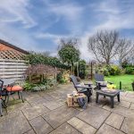 Paved patio terrace with outdoor seating overlooking the rear garden at 46 Hodge Lane Hartford