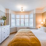 Principal bedroom with bay window and plantation shutters at 46 Hodge Lane Hartford