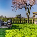 Garden terrace with countryside views at Orchard House Lach Dennis Cheshire