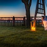 Garden lantern and seating area overlooking countryside at Orchard House Lach Dennis Cheshire