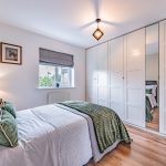 Bright bedroom with built-in storage in a home on Runcorn Road, Northwich