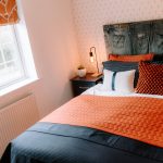 Bedroom detail with styled headboard and soft furnishings in Northwich home