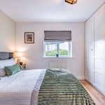Bedroom with dressing area and workspace in a Northwich home on Runcorn Road