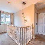 First floor landing with natural light in a detached home on Runcorn Road, Northwich