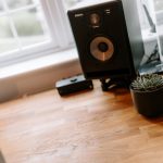 Home office desk positioned by window with natural light, ideal for working from home or creative use