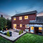 Rear view of detached home with south-facing garden and terrace on Runcorn Road, Northwich