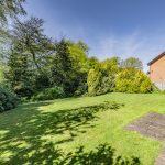Large rear garden at The Beeches, Royal Gardens, Davenham with mature planting, established boundaries and lawn space.