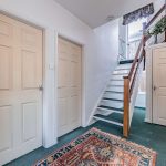 Entrance hallway within this four-bedroom detached home in Davenham, featuring a spacious layout, staircase detail and access to the principal accommodation