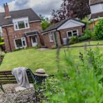 Garden seating area within the rear grounds of this detached home in Davenham, creating a peaceful setting surrounded by established planting.