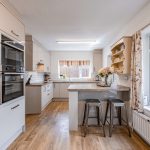 Updated kitchen within this detached family home in Davenham, offering integrated appliances, breakfast bar seating and a practical family layout.