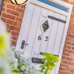 Front door detail at The Barns, Bostock Hall Estate, highlighting traditional styling, cottage character and original brickwork