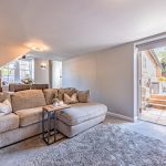 Lounge opening onto the rear patio at The Barns, Bostock Hall Estate, creating an easy connection between indoor and outdoor living