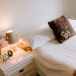 Bedroom styling detail with bedside lamp and soft neutral décor