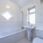 Family bathroom with bath and overhead shower at Eaton Lane Davenham