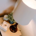 Lounge styling detail with side lamp and soft neutral décor