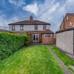 Rear garden and rear elevation of semi-detached home in Davenham