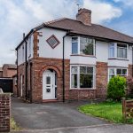 Semi-detached home on Eaton Lane in Davenham with driveway parking and detached garage