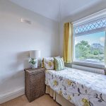 Single bedroom with garden outlook and neutral décor