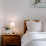 Bedroom detail with bedside table styling and soft neutral décor in Davenham cottage.