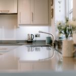 Kitchen sink and worktop detail with garden view at Pear Tree Farm, Davenham.